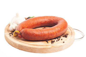 Krakow sausage with spices and garlic on cutting board