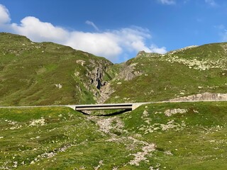 Mountain road crossing St. Gotthard Pass (Gotthardpass or Passo del Sao Gottardo) in the Swiss Alps, Airolo - Canton of Ticino (Tessin), Switzerland (Schweiz)
