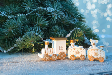 toy locomotive under the Christmas tree. Christmas and New year celebration concept, background. copy space