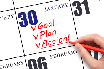 Hand writing text GOAL PLAN ACTION  on calendar date January 30. Motivation for a new day. Business...