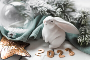 A beautiful holiday card. The concept of a happy new year and Christmas. The symbol of the year is...