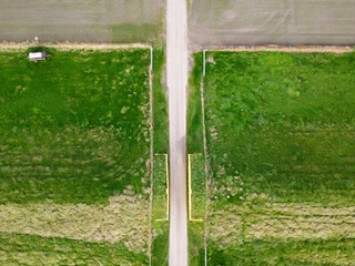 Dutch aerial view of a dike with a passage. The dike is called Diekgat and is located in the polder of Groningen.