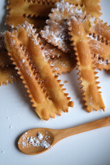 fried dessert with powdered sugar - traditional Italian recipe - closeup
