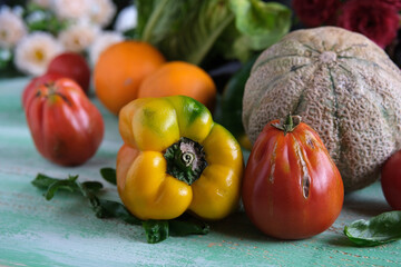fresh organic vegetables on wooden table - closeup