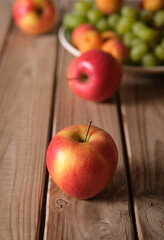 assorted fruits on wooden table - closeup