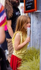 Beautiful blonde girl looks shop