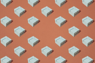 Arranged cardboard gift box on a brown background. Minimal concept and design. Pattern. Copy space.