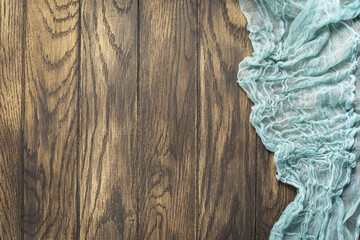 Gauze tablecloth from right side wooden table top view. Food background