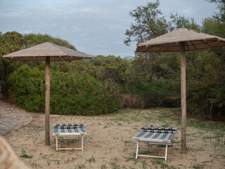 lounge chairs on the autumn beach