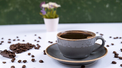 Obraz na płótnie Canvas Image of coffee mug and coffee beans on a white background