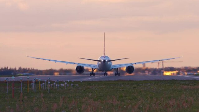 Jumbo Jet Airplane Dreamliner Plane taking off In Chopin Airport In Warsaw at dusk
