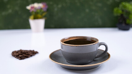 Image of coffee mug and coffee beans on a white background