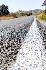 Close-up of the median strip on the side of the road.