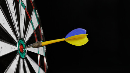 Target and dart in the colors of the flag of Ukraine. Goal concept, Ukrainian victory