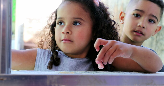 Little kids playing with toys. Small siblings play with toy. Hispanic latin children