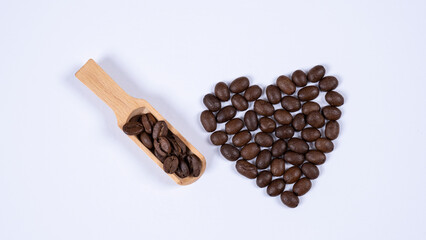Image of coffee mug and coffee beans on a white background
