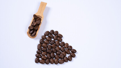 Image of coffee mug and coffee beans on a white background