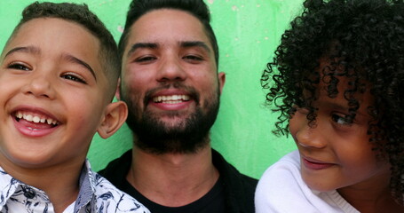 Hispanic father with children, latin kids with parent smiling, real people