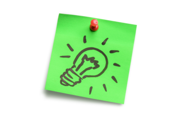 Light bulb on green adhesive notes. Idea concept