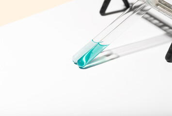 test tube with liquid with floating or suspended particles
