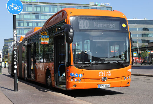 Helsinki, Finland - August 20, 2022: Orange colored articulated bus in service on line 40 at the railroad station.
