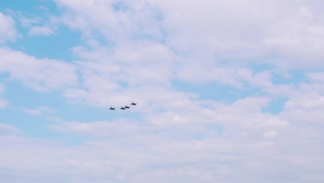 Four F-16 fighters flying in formation during an air show. HAF Hellenic Air Force demonstration on Thessaloniki, Greece during the 28 October National Oxi Day parade.