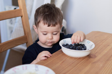 Siblings fooling around at the breakfast table