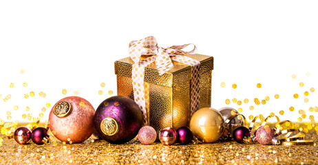 PNG. Merry christmas and a happy new year! Gift in a golden box with a bow on a golden background