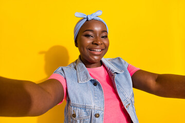 Photo of funny cheerful person make selfie recording video isolated on yellow color background