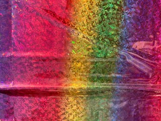 A colorful glittery surface with wrinkles