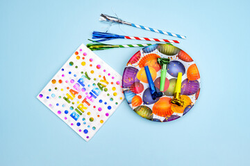 Birthday party background. Invitation card, party supplies, birthday whistles, party glasses and...