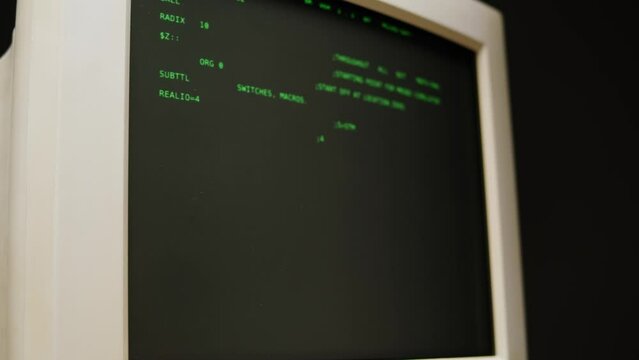 Retro pc with loading code console, programmer making scripts, green basic screen, Old computer studio close-up, Desktop vintage retro wave display, late 90s PC.