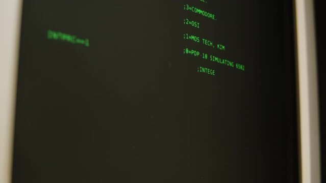 Retro pc with loading code console, programmer making scripts, green basic screen, Old computer studio close-up, Desktop vintage retro wave display, late 90s PC.