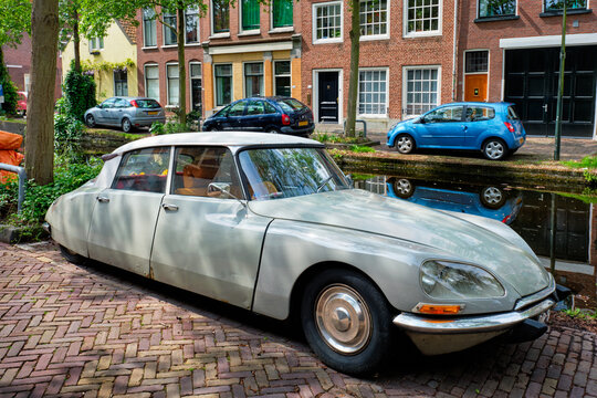 Delft, Netherlands - May 12, 2017: Retro vintage luxury car Citroen DS in street of Delft near canal