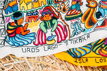 colorful handcraft of uros islands in titicaca lake, peru