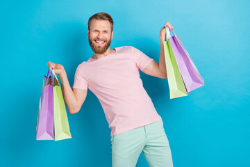 Photo portrait of attractive young guy hold shopping packages energetic dressed stylish pink look...