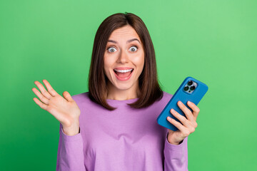 Photo of surprised lady shocked reading device followers feedback isolated on green color background