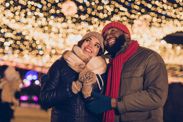 Photo of dreamy cute boyfriend girlfriend dressed winter season outfits looking noel x-mas decorations outdoors urban city street