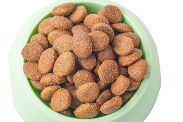 Dry animal feed in a green bowl. Balanced nutrition for cats or dogs. Food for pets.