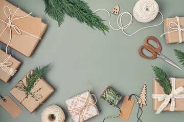 Christmas background with gift boxes and  kraft wrapping paper. Xmas celebration, preparation for winter holidays. Festive mockup, top view, flatlay
