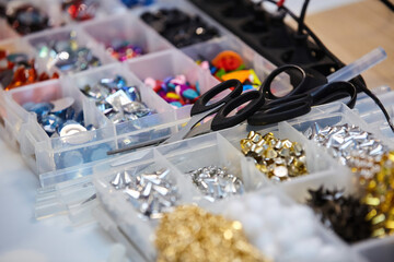 Various materials for needlework. A set of rivets, chains and other creative items.