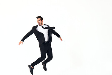 Fototapeta na wymiar Man business smile with teeth in costume running and jumping up full-length on white isolated background copy space 
