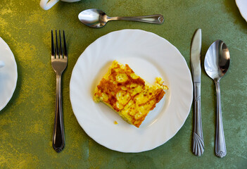 Portion of omelet served in eatery for breakfast