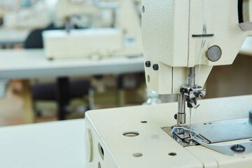Industrial sewing production or atelier. Sewing machines for creating clothes.