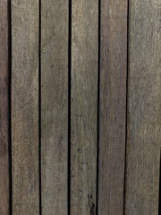 Wood texture with some imperfections and grooves. Rustic wooden boards. Some leaves on top. Top view