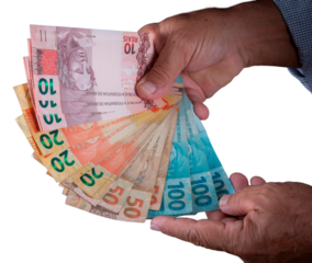 Hand holding Brazilian money banknotes. png transparent background