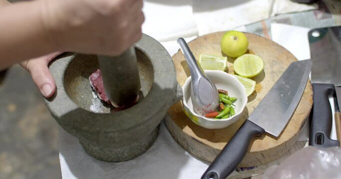 Making Thai shrimp paste chili paste, there are ingredients such as shrimp paste, chili, and lime.