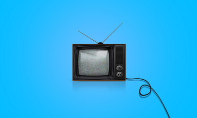 Retro old TV vintage style on blue background. old fashioned Television with grainy noise screen  On floor with cable. Nostalgia 