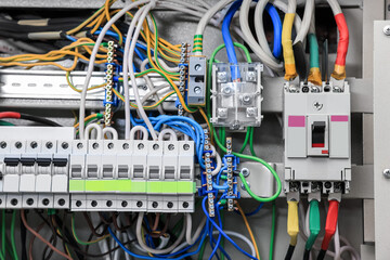 Electrical panel with many wires in fuse box, closeup