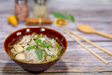 Thai and chinese food boat noodles, pork meatballs in a bowl look delicious.